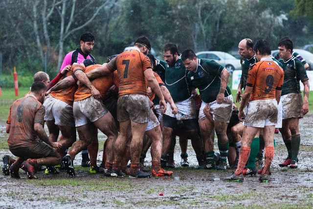 Club, rugby player in mud